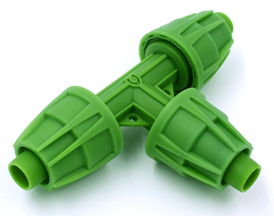 Close-up of FloraFlex 16/17mm tee fitting for connecting three irrigation tubes in a T-junction.