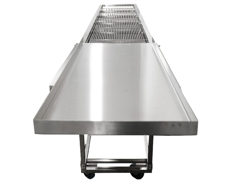 End view of the GROW1 harvest table showing flat stainless steel prep surface and sorting racks in background.