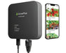 GrowFlux Access Point connected with cables, shown beside smartphone running GrowFlux app for control.