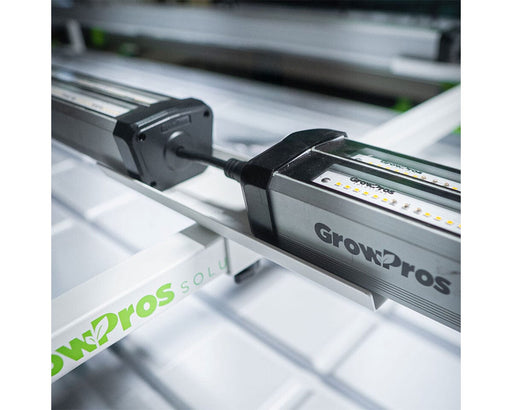 Detail of GrowPros under canopy light mounted securely on bridge stand, showing LED diodes and wiring.