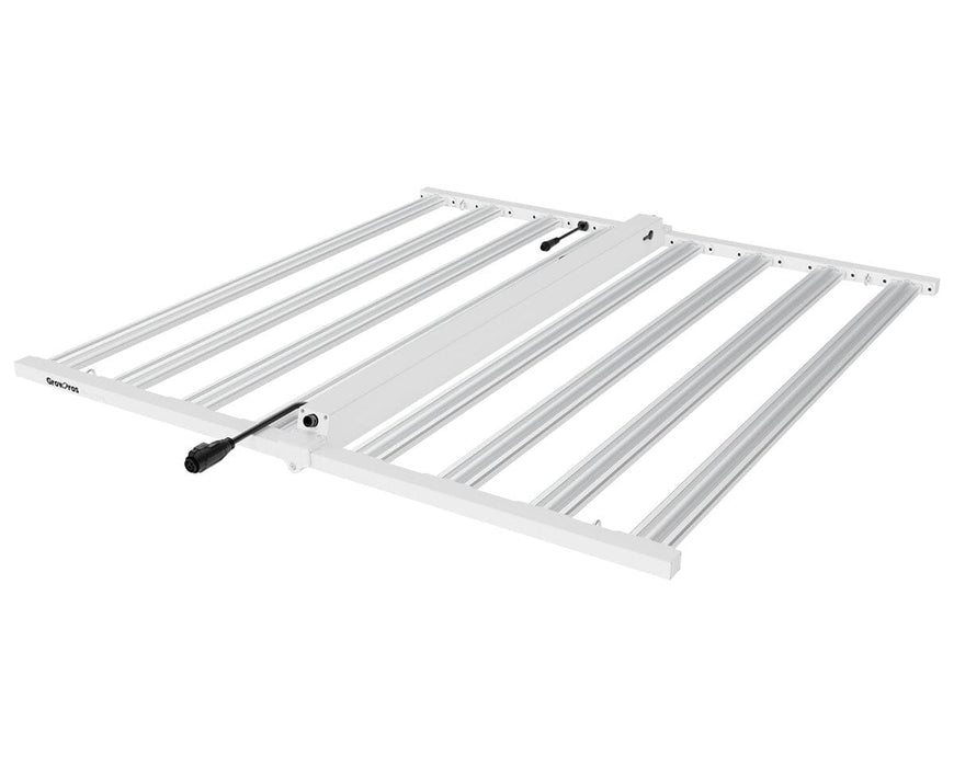 Angled view of UltraPro LED grow light with diodes off, showing aluminum bars and integrated power cabling.