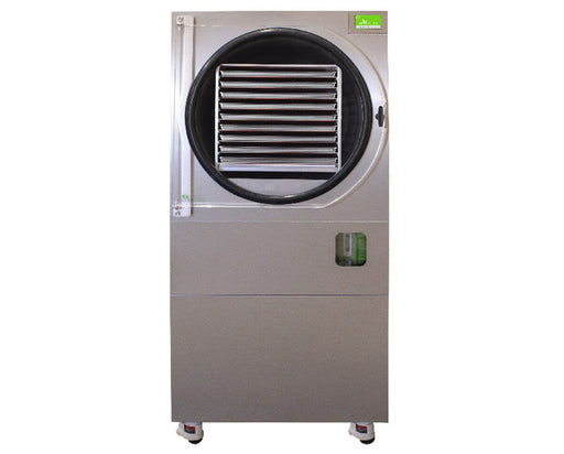 Front view of the Harvest Right HRC100 Pro freeze dryer showing its stainless steel exterior and open drum with multiple standard baking sheet trays stacked inside.