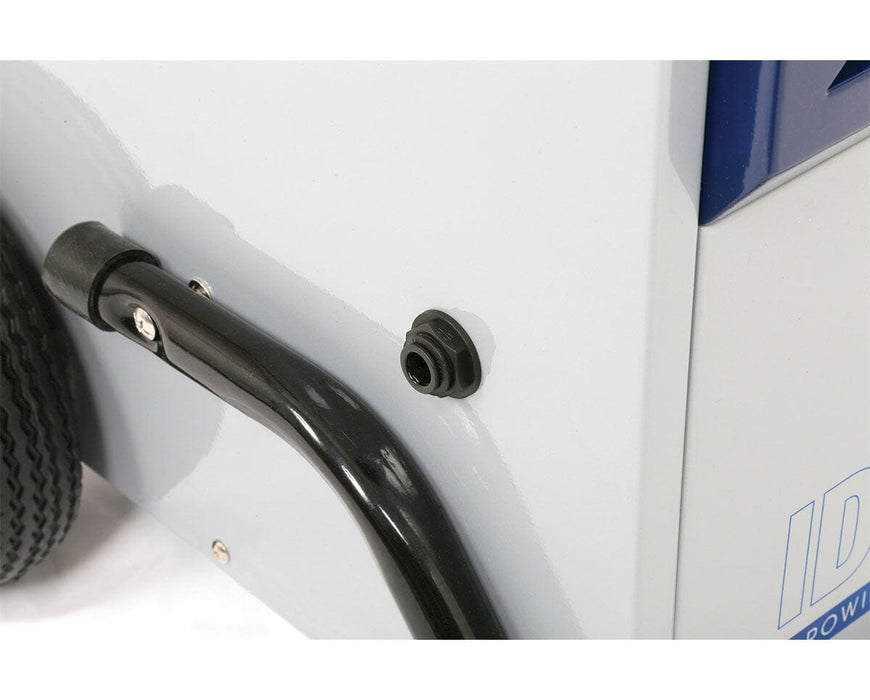 Detail of the side of the dehumidifier showing a black rubber drain port and a portion of the wheel and handle structure.