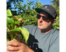 Grower wearing Method Seven Evolution FX2 LED glasses outdoors for UV protection and color correction.