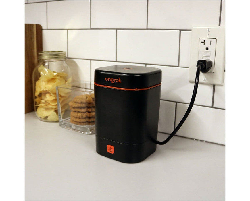 Ongrok Decarboxylator Machine plugged in and in use on a kitchen counter, compact design with one button functionality for easy decarboxylation at home.
