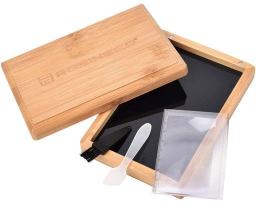 Rosineer bamboo base box with magnifying lens, scraper, and brush tools shown on black glass tray for pollen work.