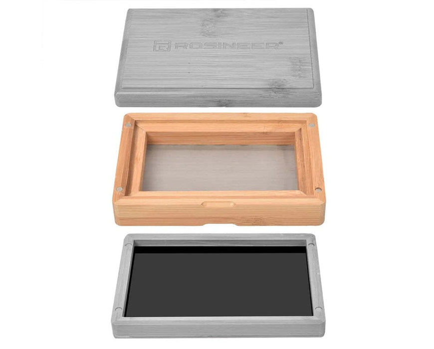 Disassembled Rosineer bamboo pollen sifter showing mesh screen tier, magnetic black base tray, and bamboo lid.