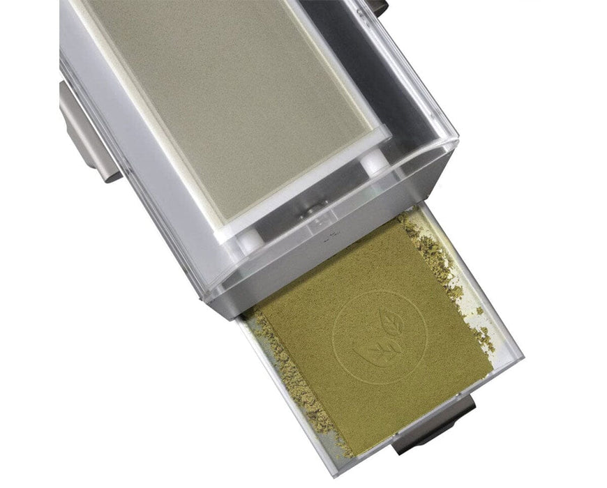 Rosineer PTX Tumbler showing green sifted kief collected in removable tray with pressed logo for trichome extraction.