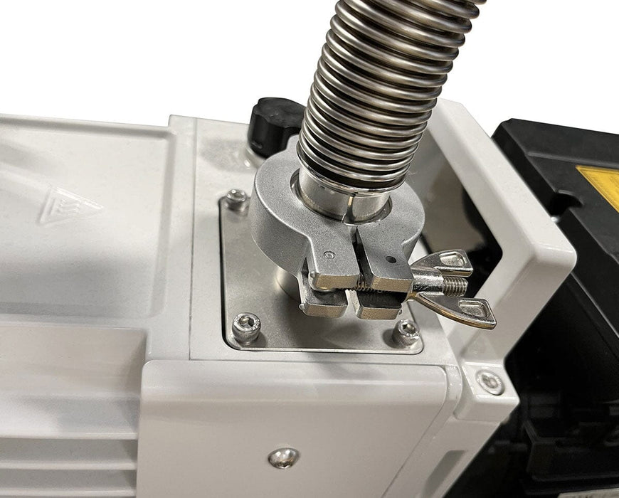 Stainless steel vacuum hose connection secured with clamp and wing nut on freeze dryer unit.