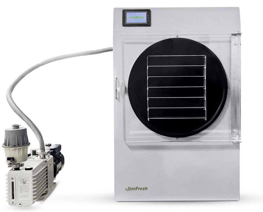 Front view of Stay Fresh Mega Freeze Dryer with clear door, six-tray shelf system, and pump attached.