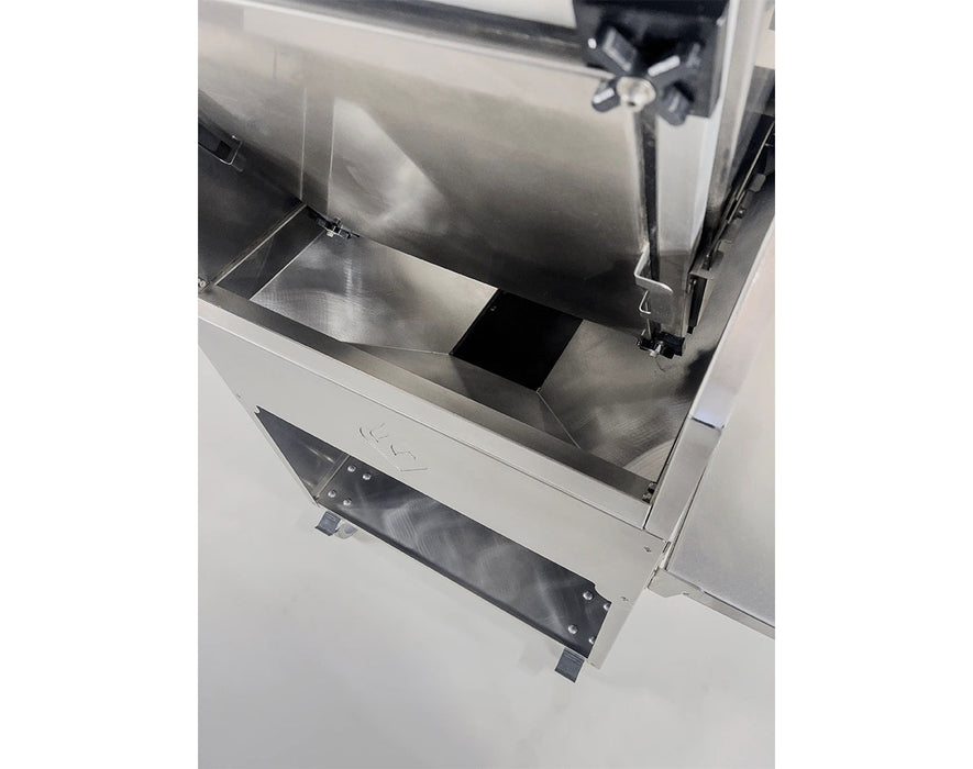 Frontal view of the sifting screen in the open position for loading and processing plant material.