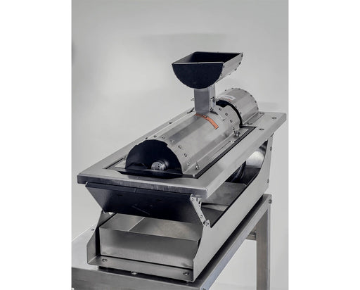 Close-up of GreenBroz G-Lite perforated drum used for grinding and separating stems from cannabis flower.