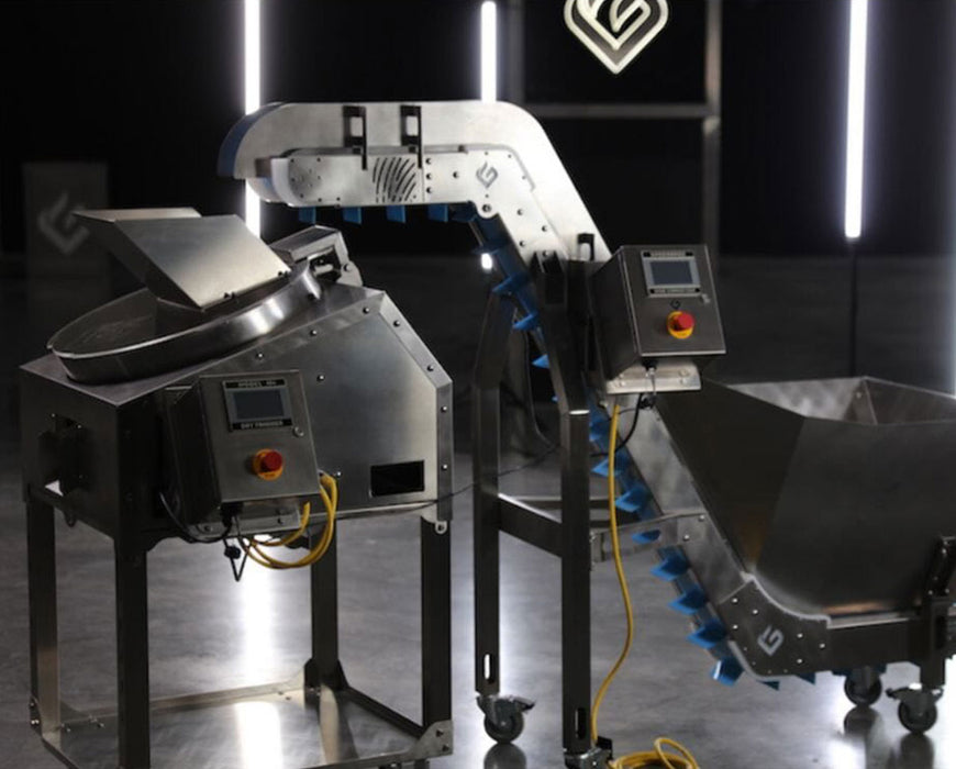 GreenBroz M+ Trimming System fully assembled in a studio setting with conveyor system and dual touchscreen control panels.