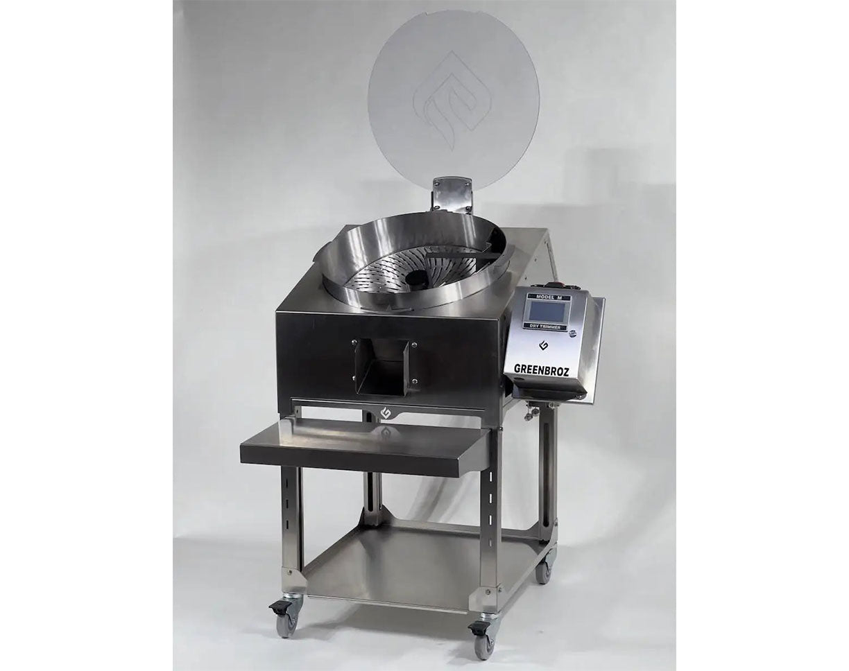 Top-down view of GreenBroz Model M trimming surface showing detailed spiral blade slot pattern for dry trimming.