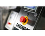 Close-up of GreenBroz N-Line conveyor touchscreen control panel displaying continuous feed and foot pedal options.