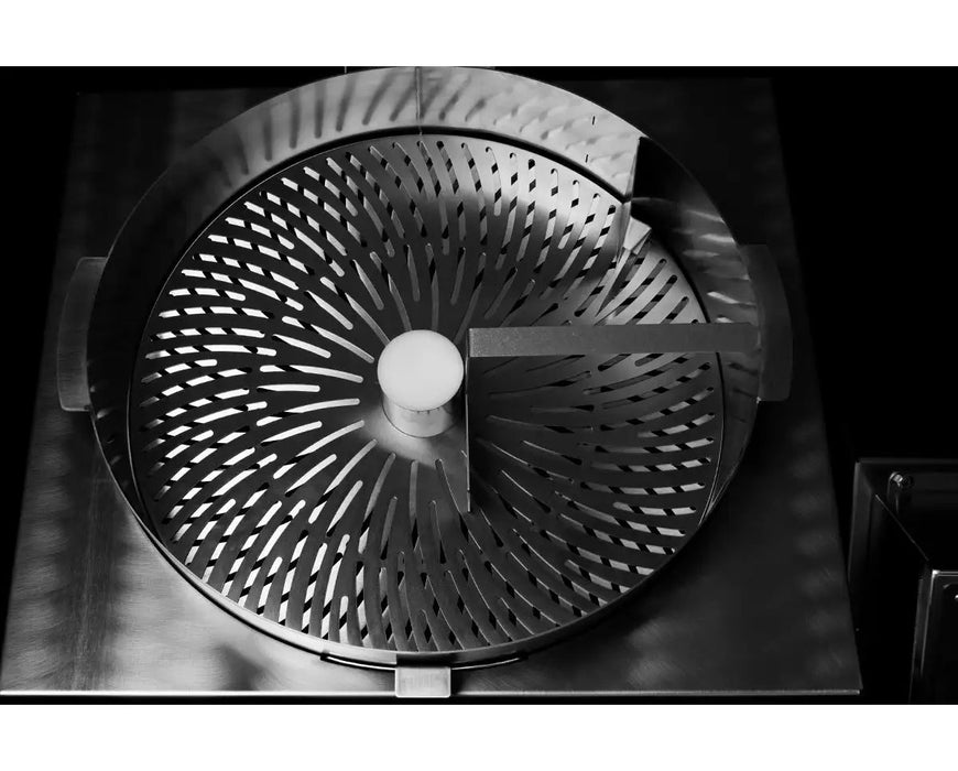 Overhead view of GreenBroz N-Line System trimmer feed chute and conveyor belt designed for seamless material transfer.