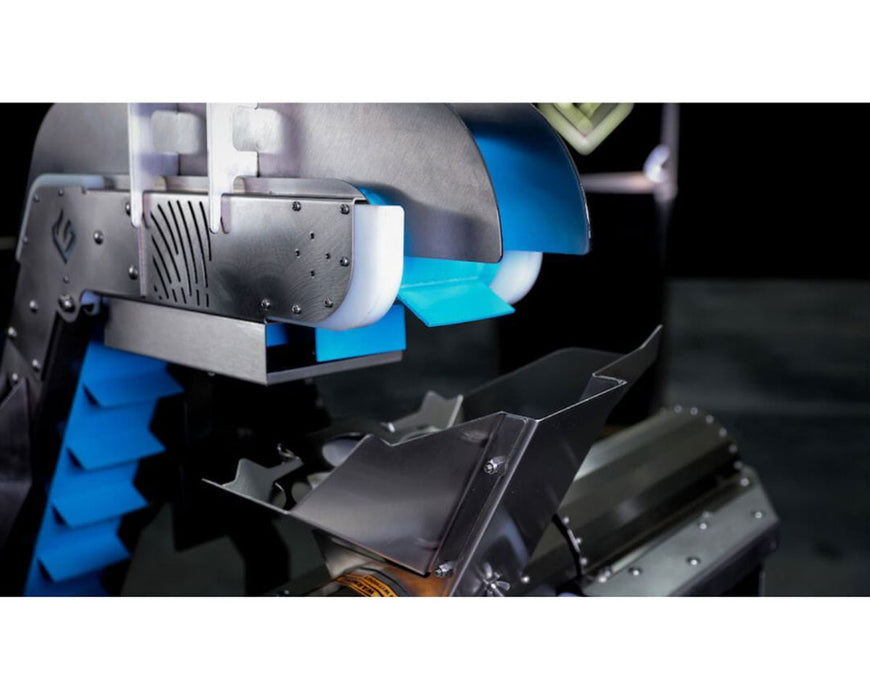 Top view of GreenBroz Rise Conveyor feeding cannabis into grinder with angled stainless steel chute.