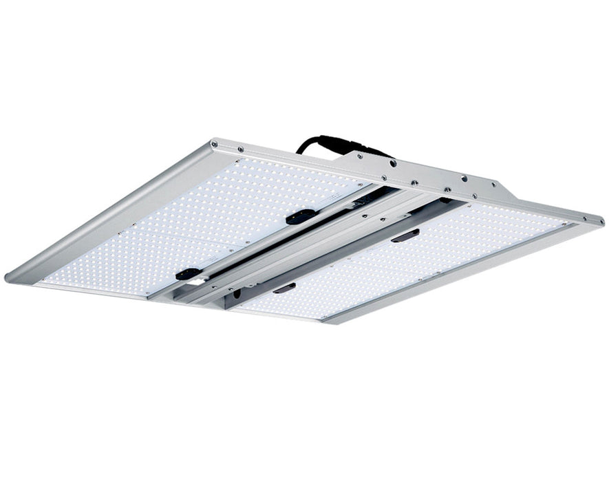 Angled view of the lit NextLight Core Pro 210W LED Grow Light showcasing LED intensity and uniform light panel.