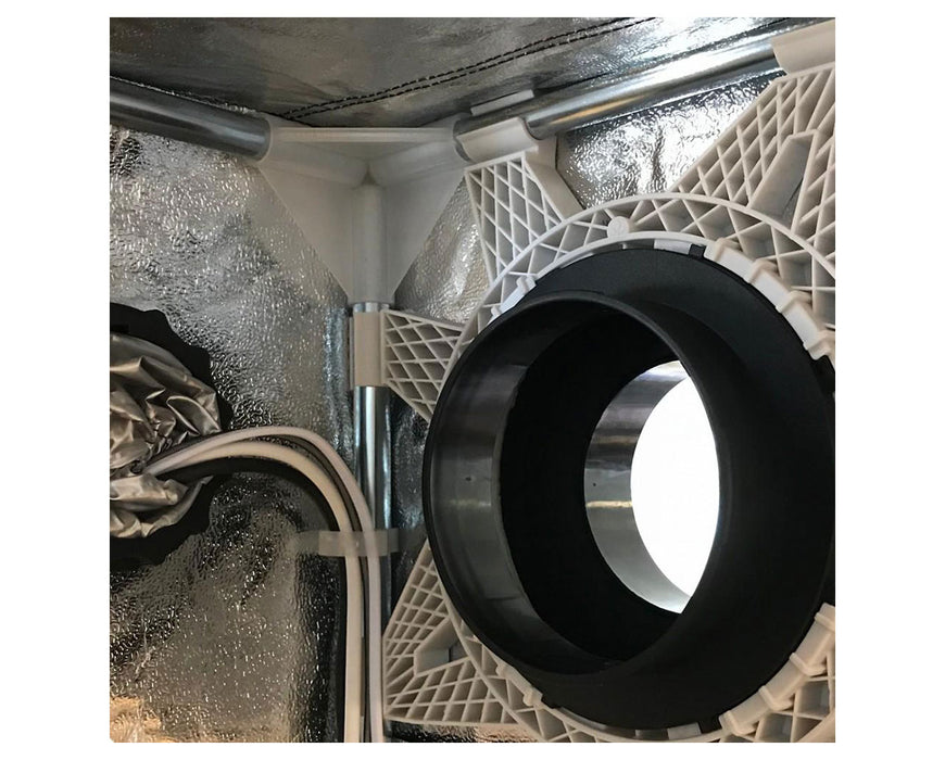 Close-up view of a Secret Jardin grow tent corner showing ducting, wiring, and plastic frame connectors against a reflective interior.