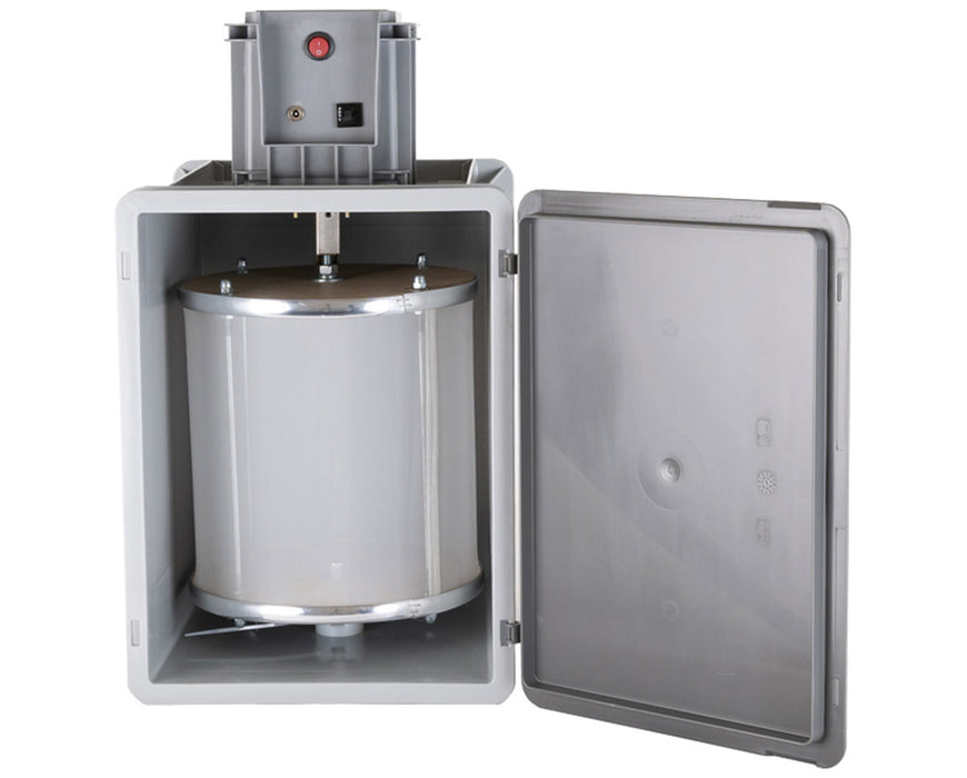 Interior view of the Bubble Magic Pollen Tumbler showing the mesh drum inside the machine’s open compartment with motor controls on top.