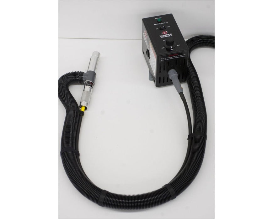 EZ Trim Wander Trimmer handheld wand connected to variable speed control box with suction hose, designed for wet trimming with precision cuts.